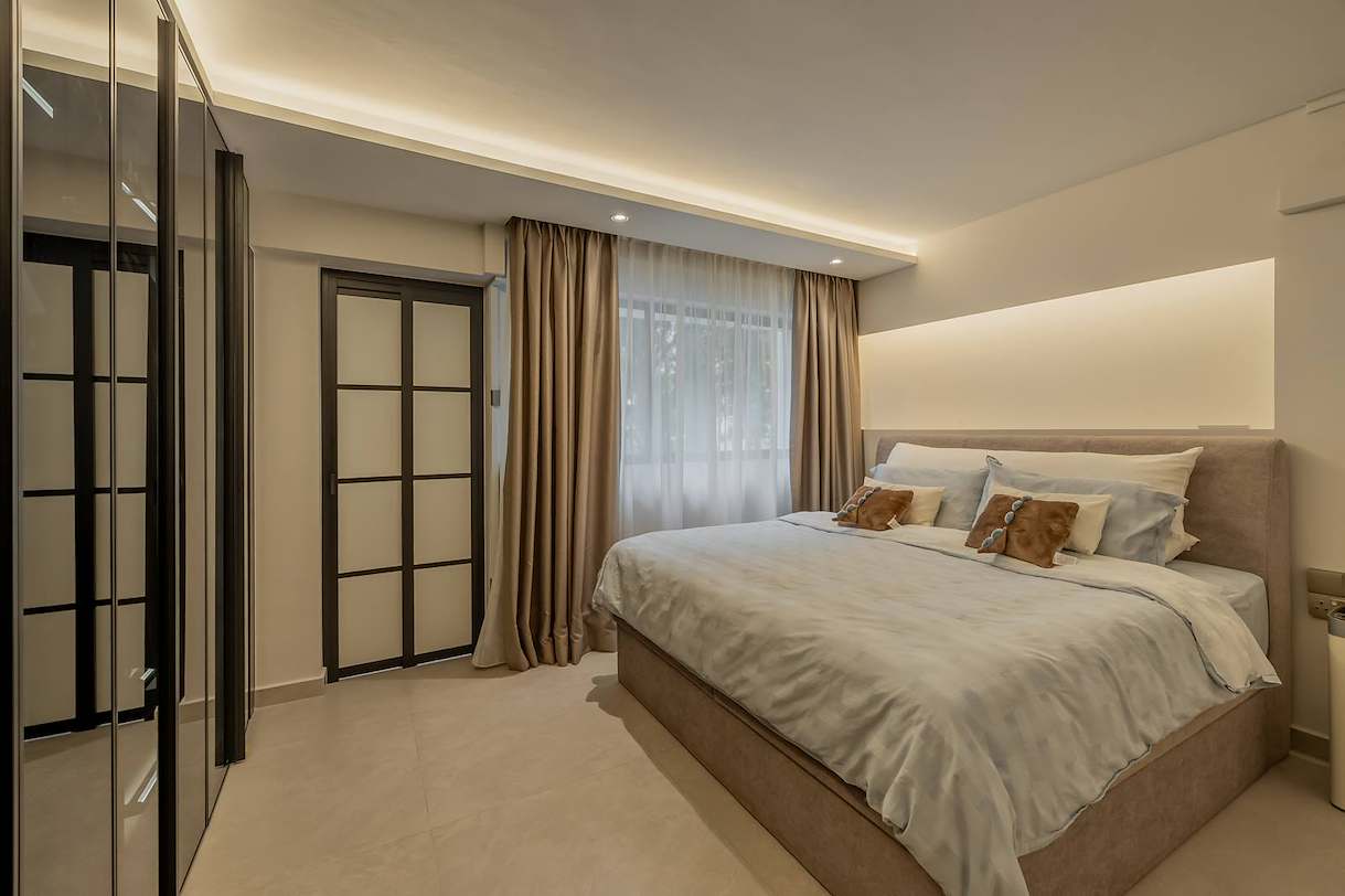 Modern 4-room HDB bedroom in Ang Mo Kio with built-in wardrobes, glass doors and warm ambient lighting