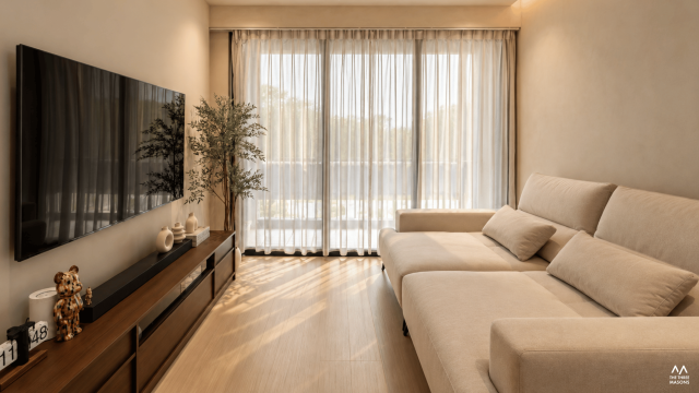115 Compassvale 115 Compassvale HDB living room with sheer curtains, a neutral sofa and natural daylight