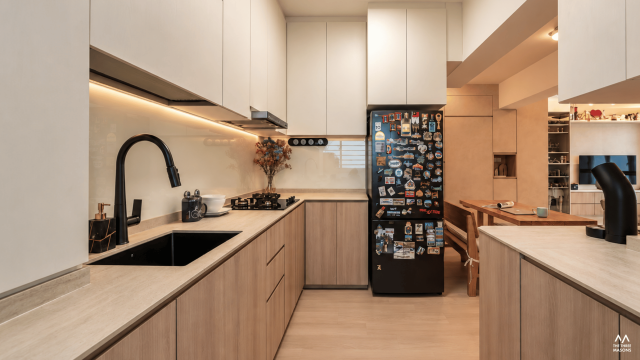 141A McNair 141A McNair HDB kitchen with wood cabinetry, a dark countertop and a built-in refrigerator