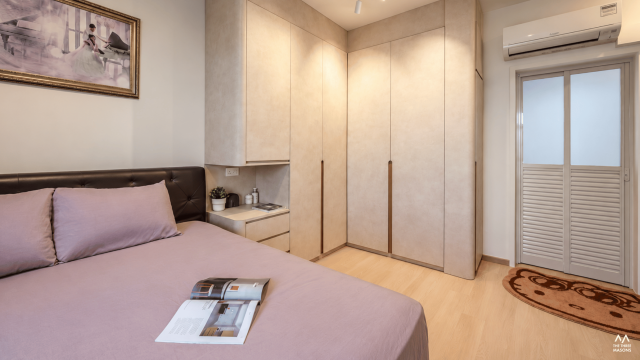 141A McNair 141A McNair HDB bedroom with a built-in wardrobe and warm neutral finishes