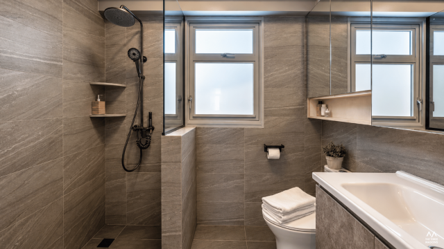 141A McNair 141A McNair HDB bathroom with grey wall tiles, a window and a glass shower screen