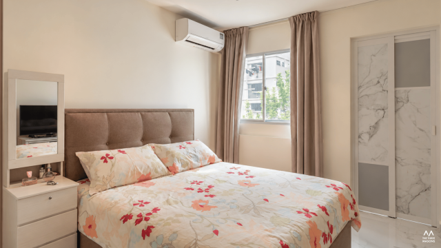 149 Woodlands 149 Woodlands HDB bedroom with a neutral upholstered bed and soft natural lighting