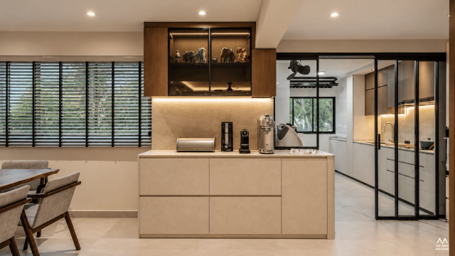 171 Ang Mo Kio 171 Ang Mo Kio HDB kitchen with dark wood cabinetry and an integrated dining area