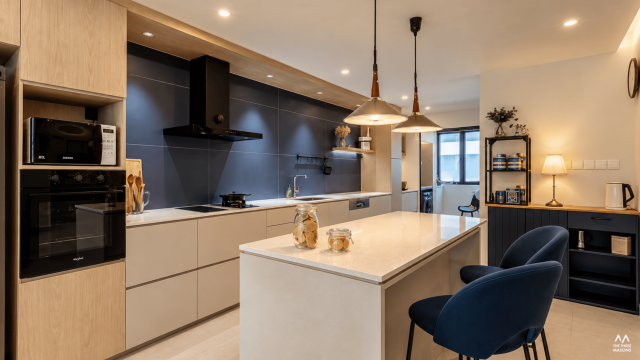 225 Kim Keat 225 Kim Keat HDB kitchen and dining area with a wood dining table and dark contemporary cabinetry