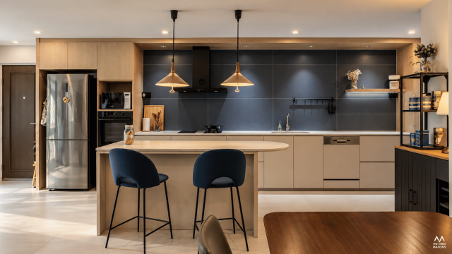 225 Kim Keat 225 Kim Keat HDB kitchen with a breakfast counter, dark cabinetry and pendant lights