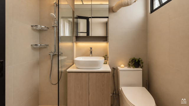 225 Kim Keat 225 Kim Keat HDB bathroom with a minimalist vanity and glass shower enclosure