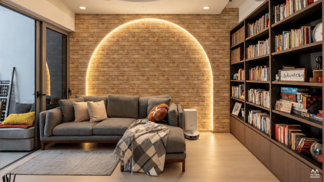 36 Fernvale 36 Fernvale HDB living room with a curved illuminated feature wall and built-in shelving