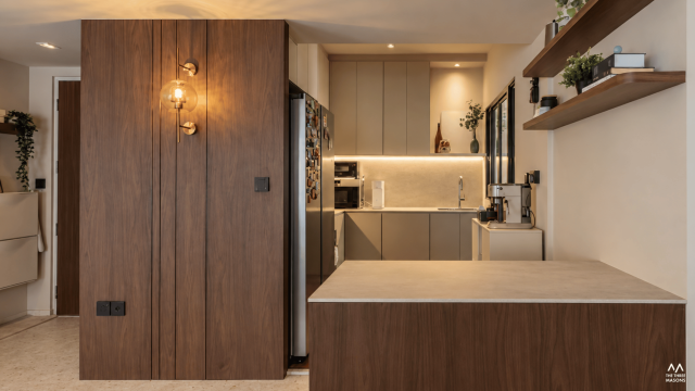 448B Punggol 448B Punggol HDB interior with a wood-finish entrance door and warm-toned kitchen cabinetry