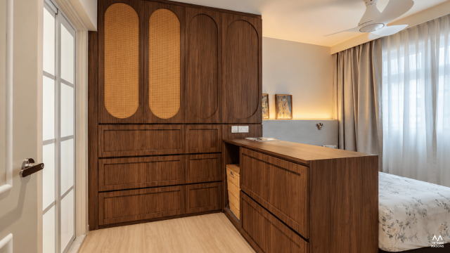451A Bukit Batok 451A Bukit Batok HDB bedroom with a dark wood wardrobe and rounded decorative panels