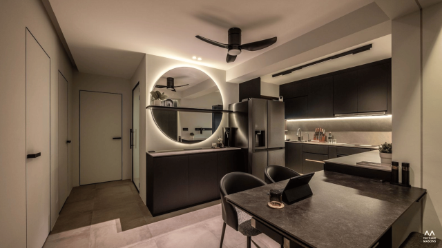 532A Bishan Modern HDB kitchen at 532A Bishan featuring black cabinets, a dark stone dining table and warm under-cabinet lighting