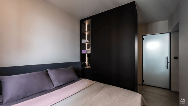 532A Bishan Contemporary bedroom at 532A Bishan with black-framed glass wardrobe doors, illuminated shelving and warm lighting