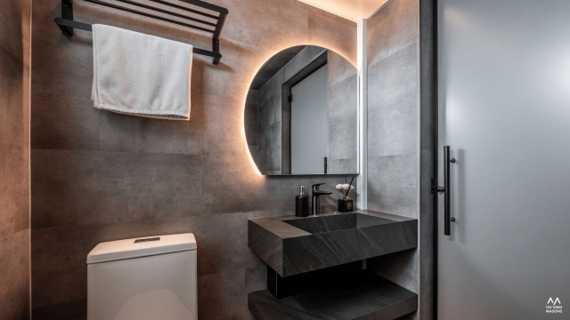 532A Bishan Contemporary HDB bathroom at 532A Bishan with dark stone vanity, grey wall tiles and a large illuminated mirror