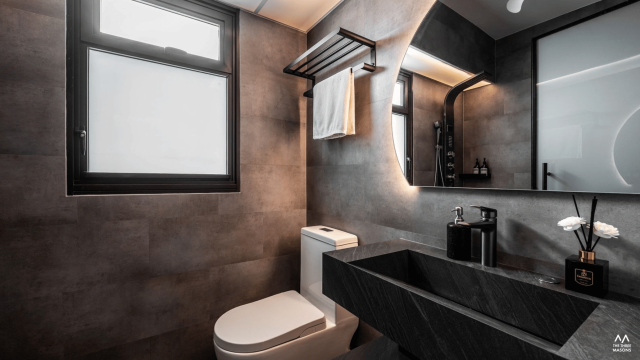 532A Bishan Modern bathroom at 532A Bishan featuring a black vanity, warm grey tiles, an overhead shower and a backlit mirror