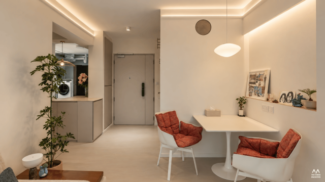 590B Pasir Ris 590B Pasir Ris HDB bedroom with a neutral bed, warm wood finishes and natural light