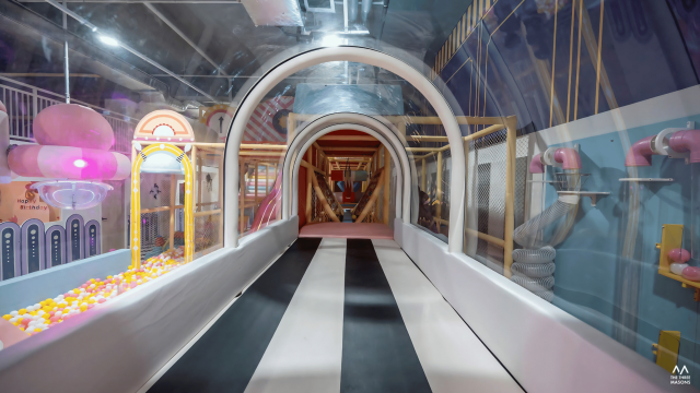 Kidodo Space Kidodo Space indoor play area with a themed tunnel and colourful play structures